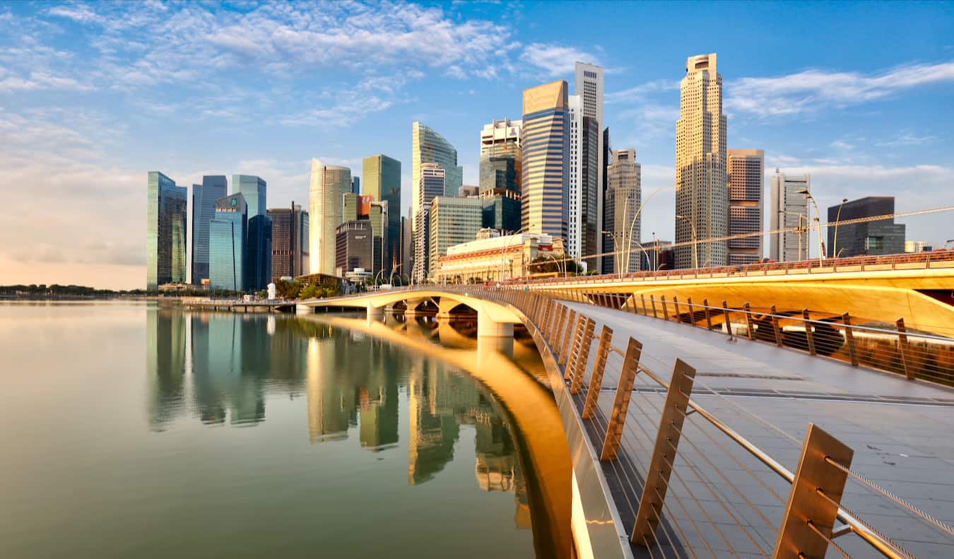 A sunny day in Singapore near the coast looking out at the city's skyline