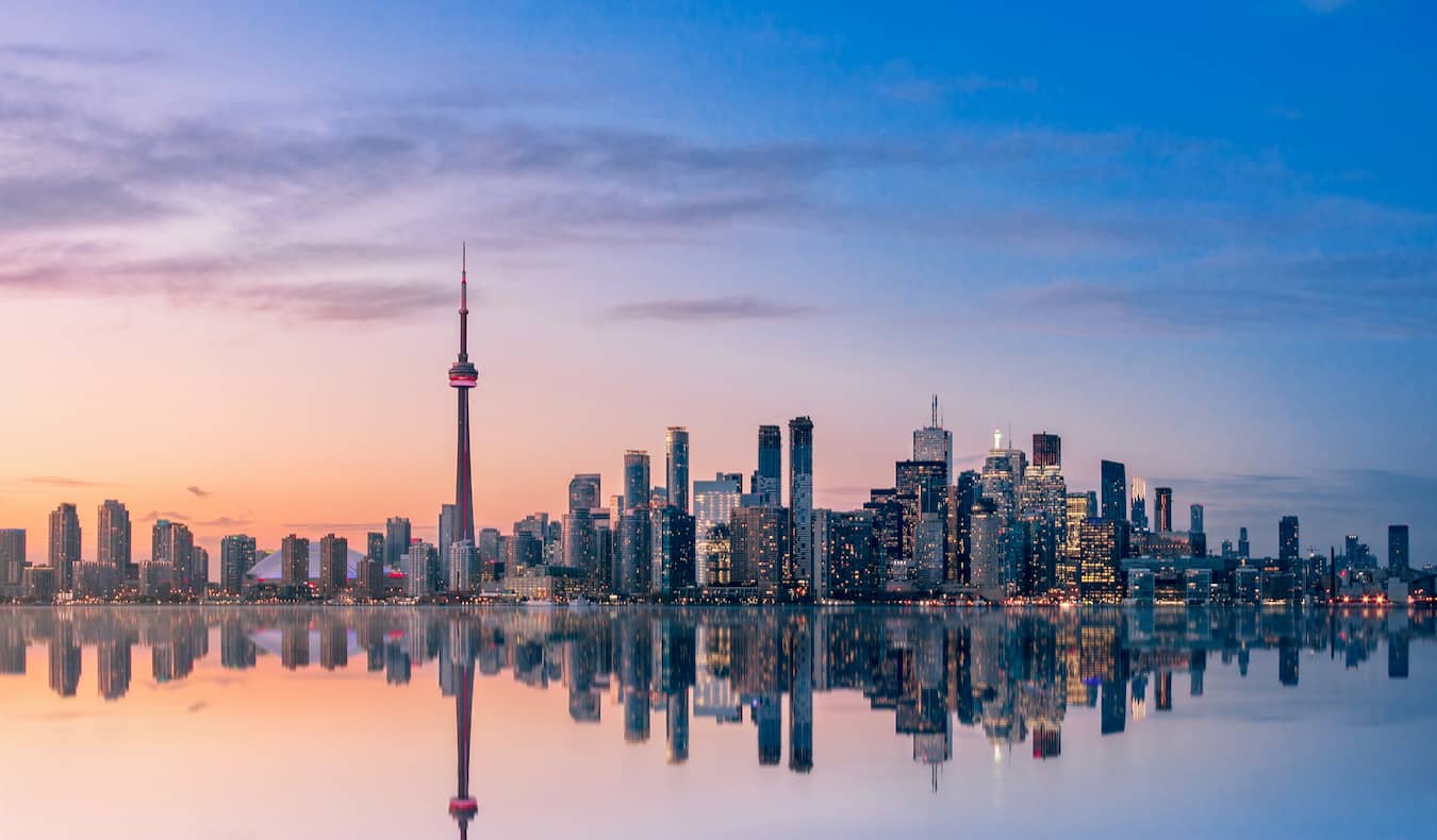 A beautiful pastel sky over the downtown skyline of Toronto, Ontario on the shore of Lake Ontario