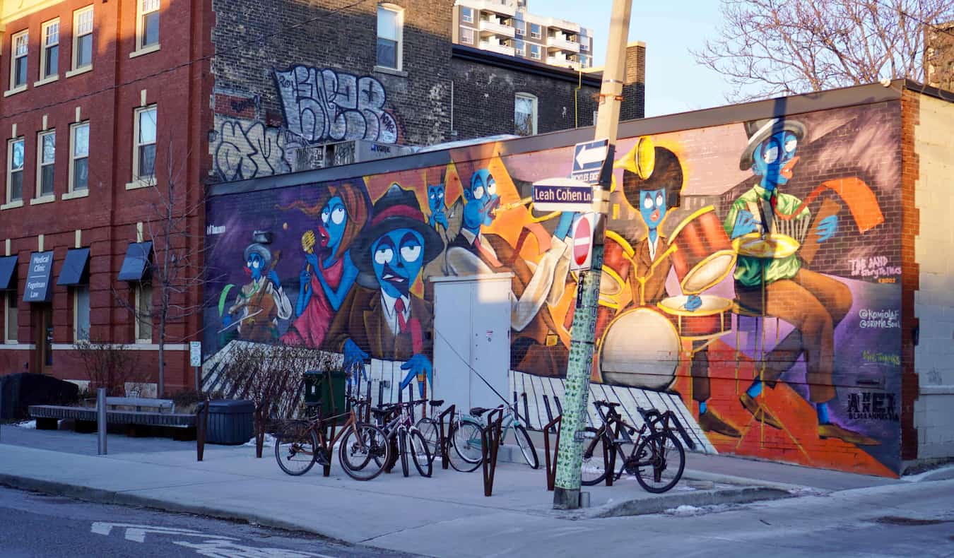 Street art on an old building on a quiet street in Annex, Toronto, Canada