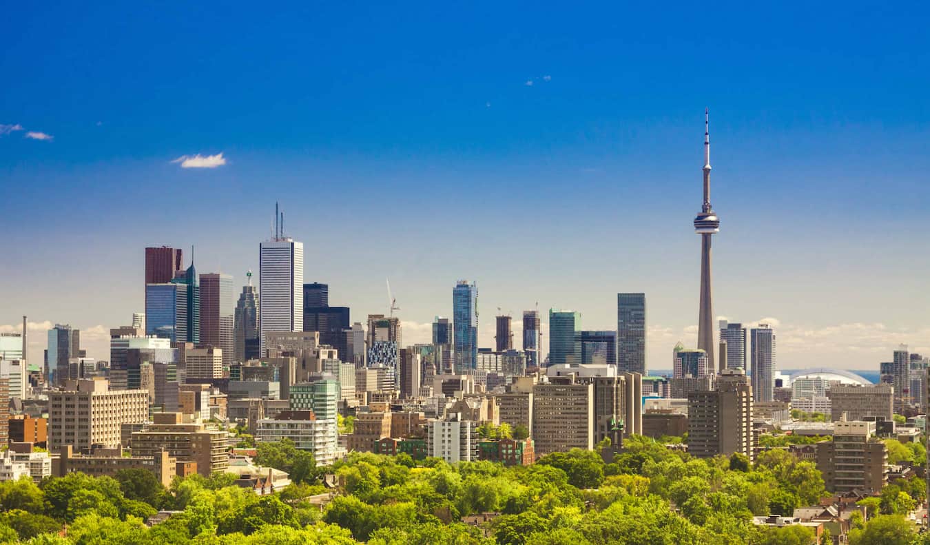 The towering skyline of Toronto, Canada on a bright and sunny summer day