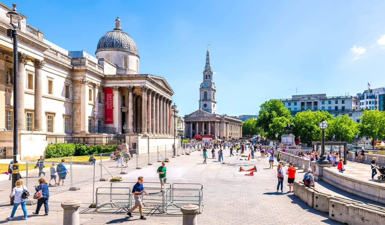 The National Gallery of Art in London with people walking outside in summer at Trafalgar Square
