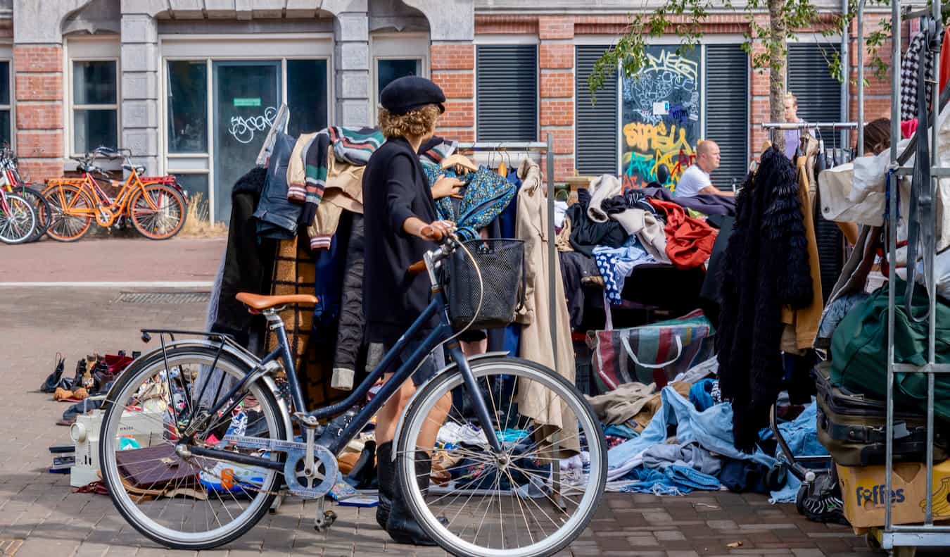 Books and clothing for sale at the Waterlooplein Flea Market in Amsterdam, Netherlands