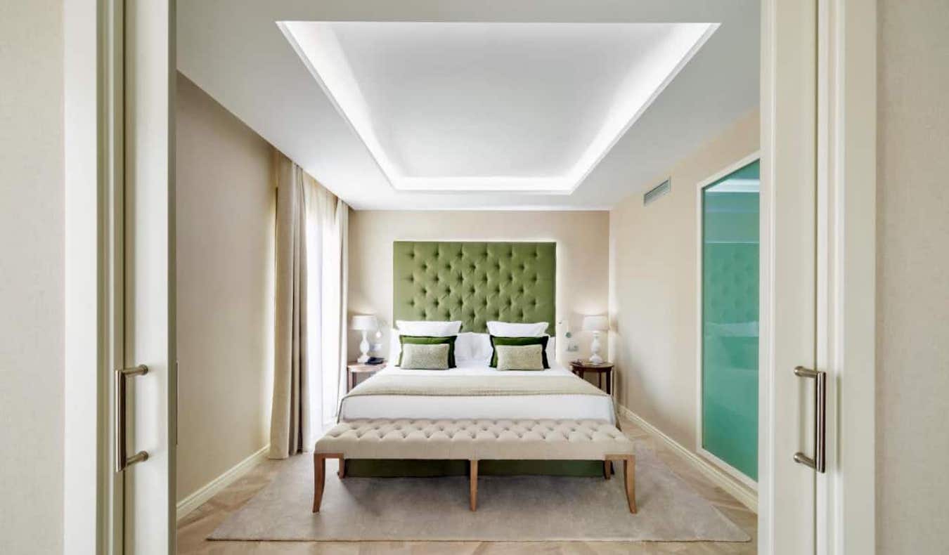 A calm, minimalist hotel room at Hotel Colon in Barcelona, Spain