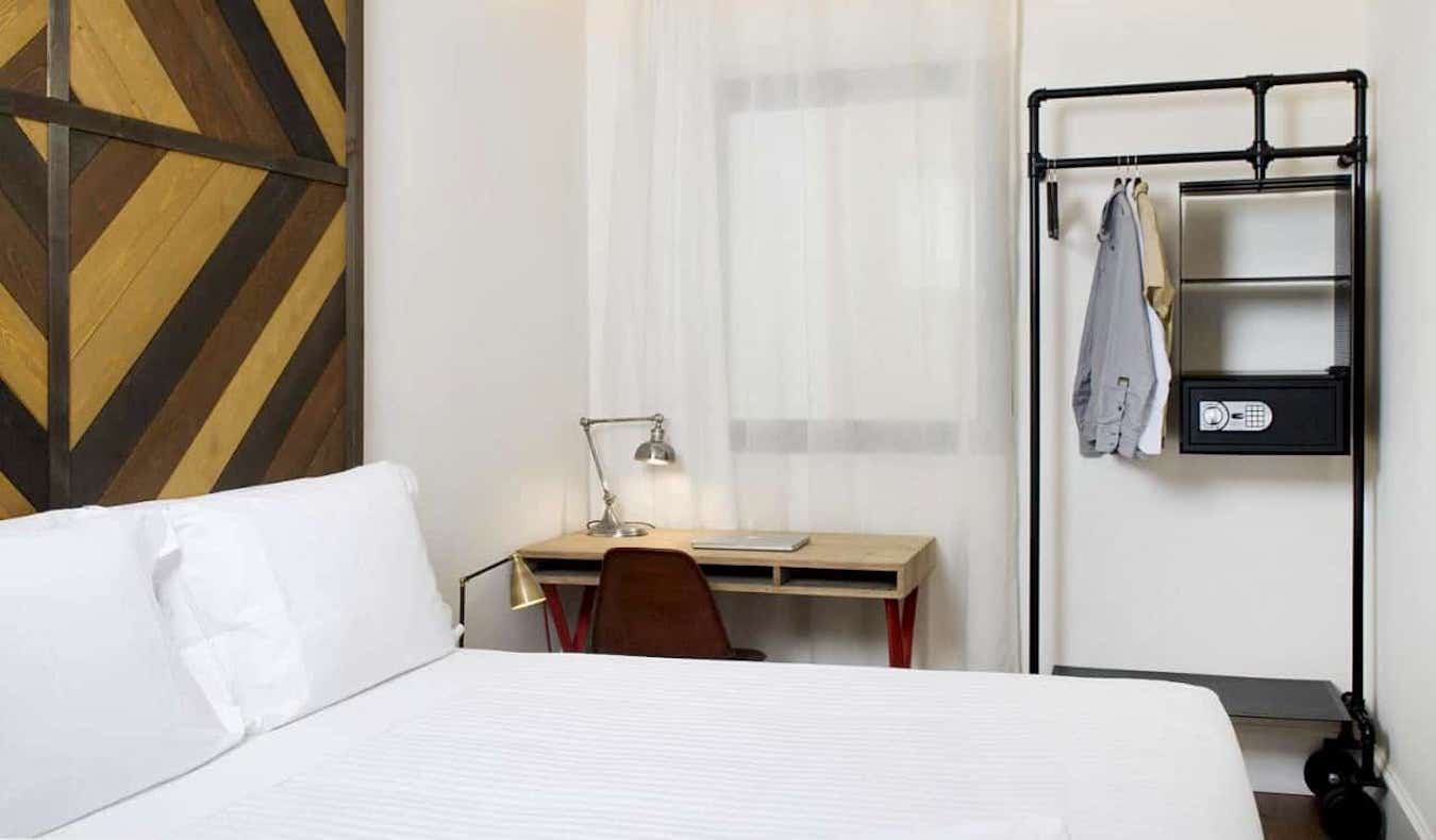 A small but tidy hotel room with lots of natural light in Barcelona, Spain