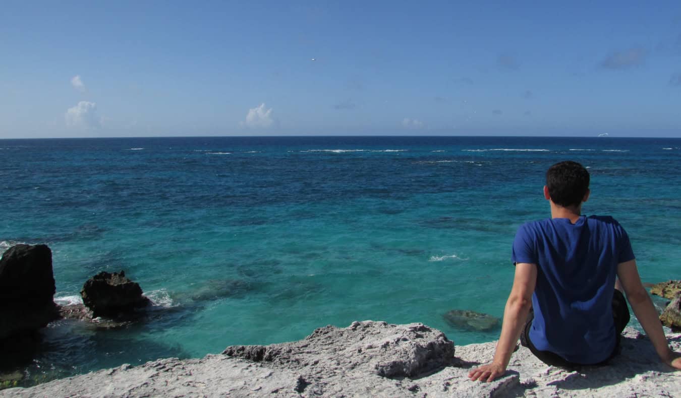 Nomadic Matt overlooking the blue waters of the island of Bermuda