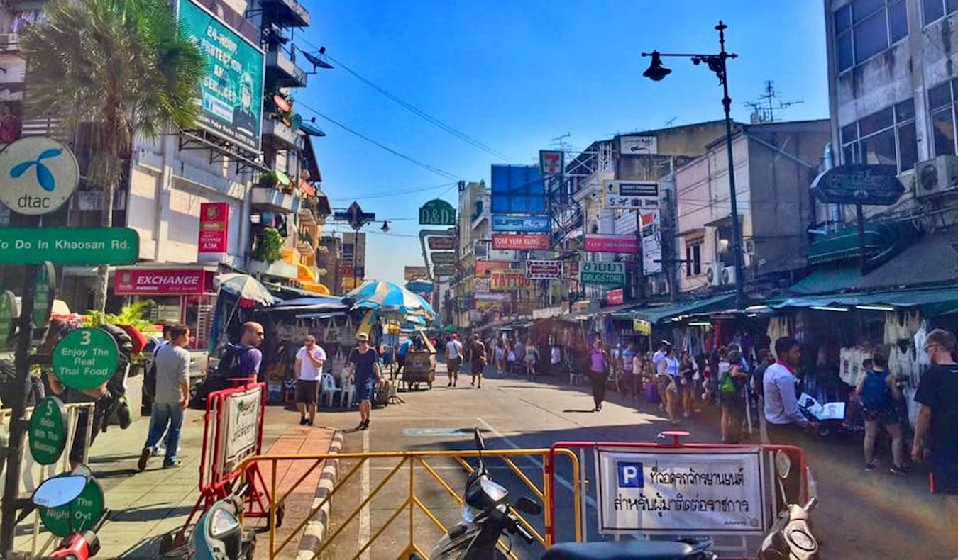 Backpackers on the famous Khao San Road, Bangkok's main party street, on a busy sunny day