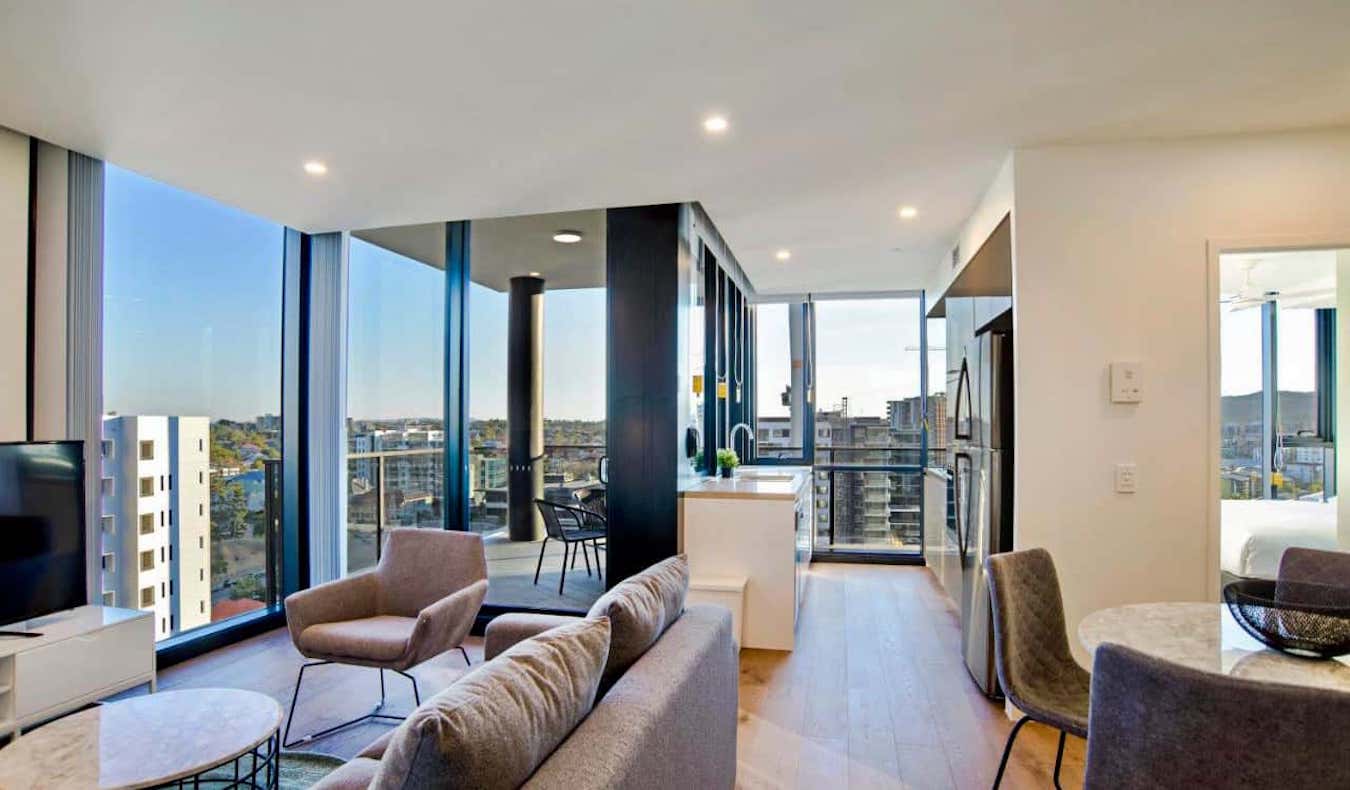 A large, well-lit apartment hotel room with lots of natural light in Brisbane, Australia