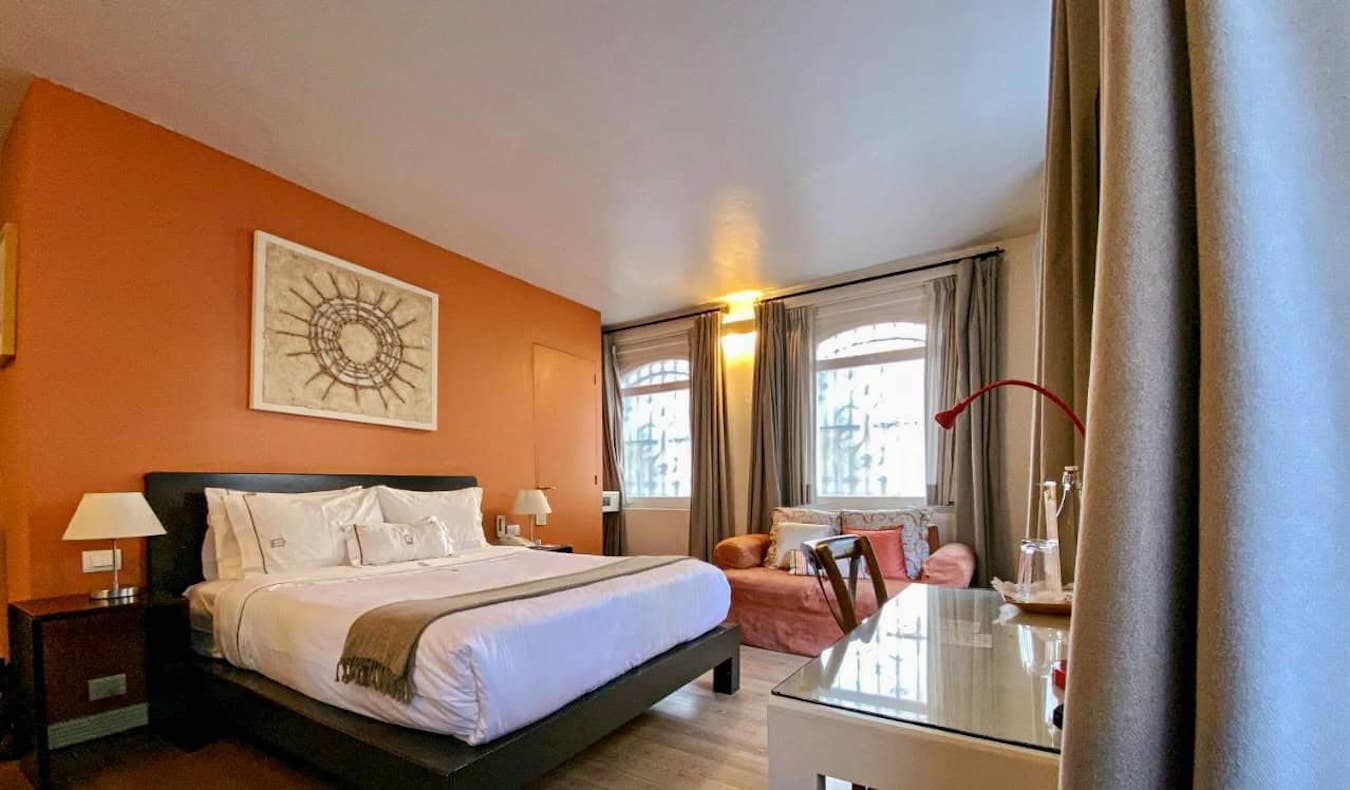 A large bed in a bright hotel room at the Hotel Villa Condesa in Mexico City