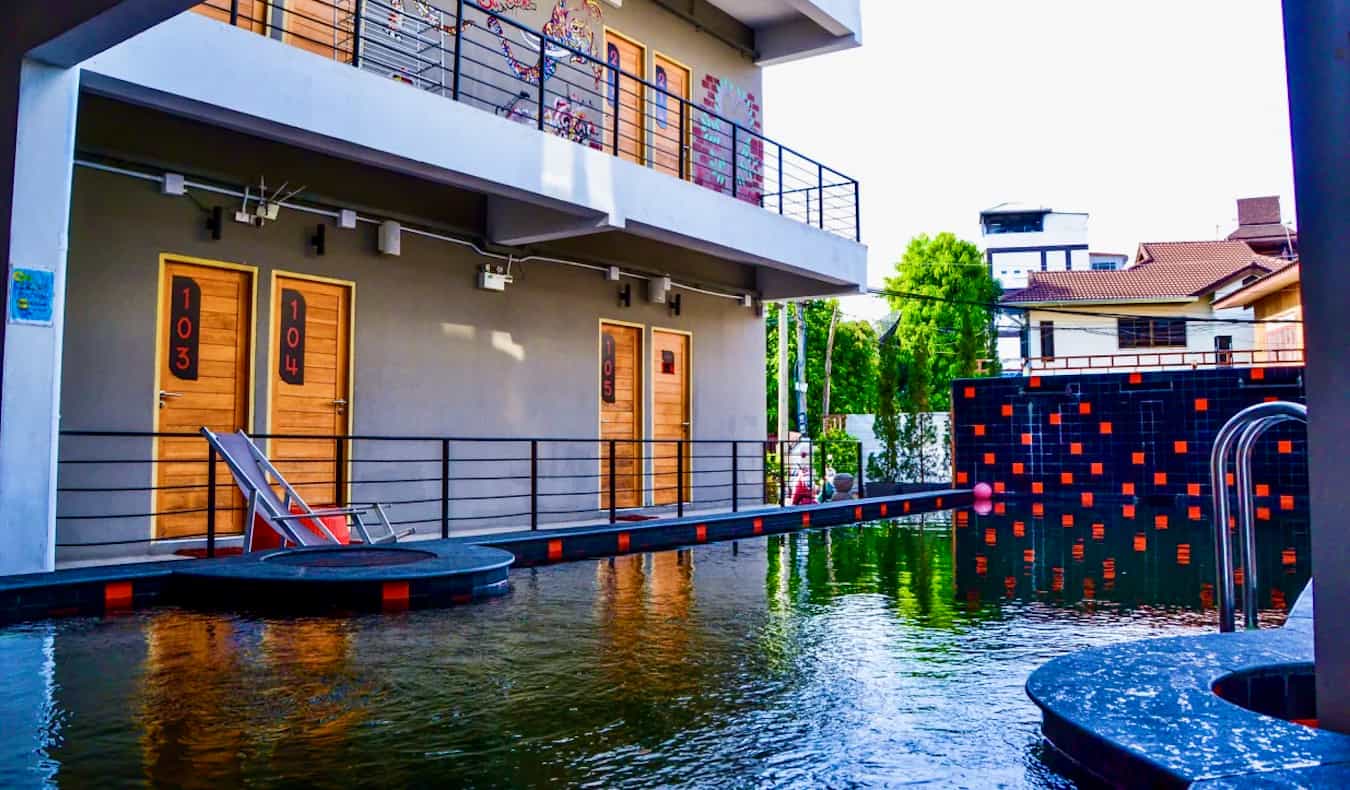 Fun outdoor pool area at Mad Monkey Hostel in Chiang Mai, Thailand