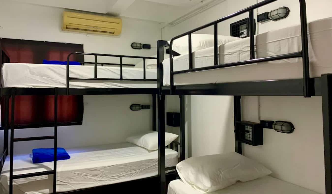 Simple bunk beds in a dorm at the Revolution party hostel in Chiang Mai, Thailand