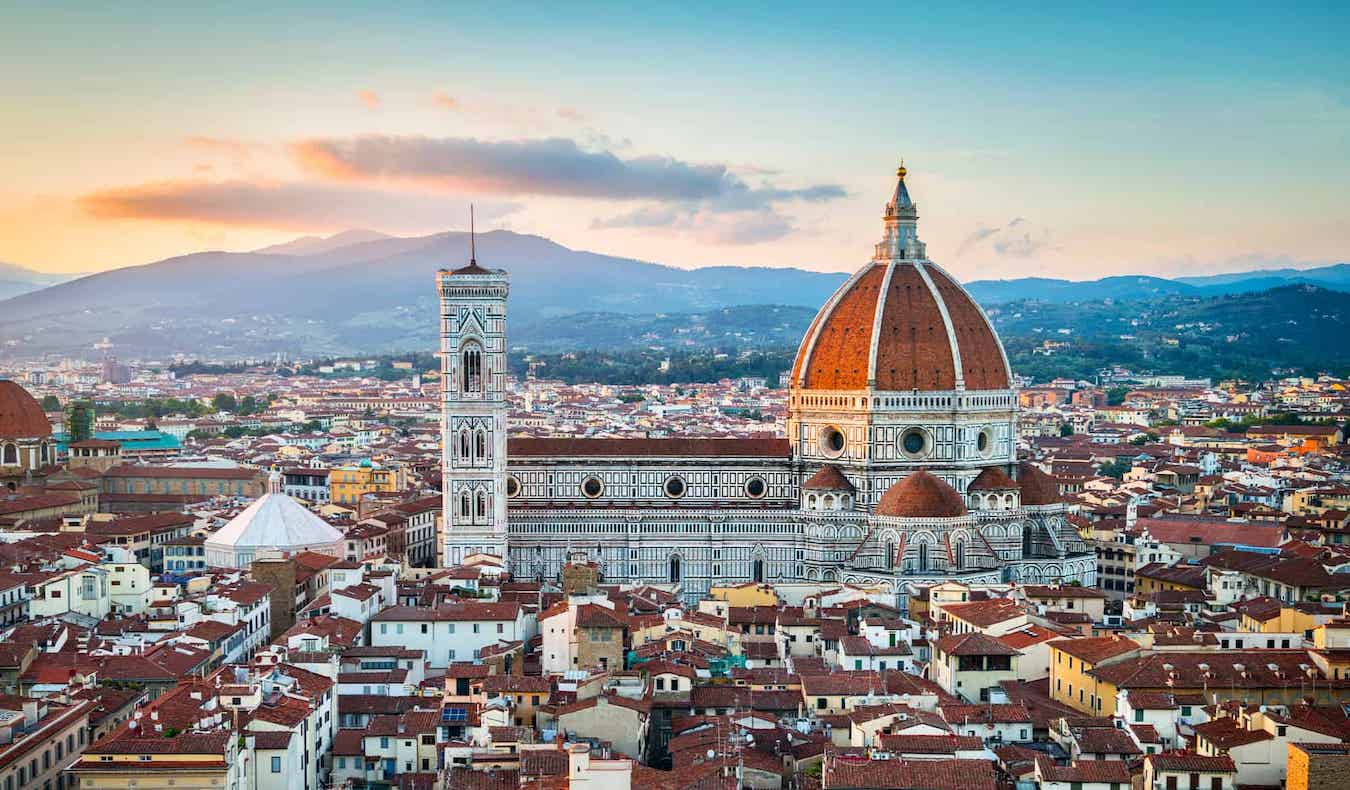 The famous dome of the cathedral poking up from the stunning skyline of historic Florence, Italy