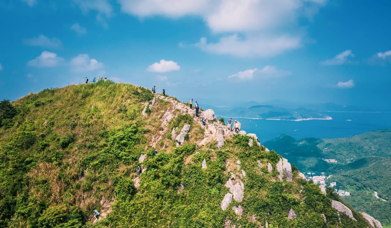 People walking on Footpath on a sharp mountain in Clear Water Bay, Sai Kung, Hong Kong