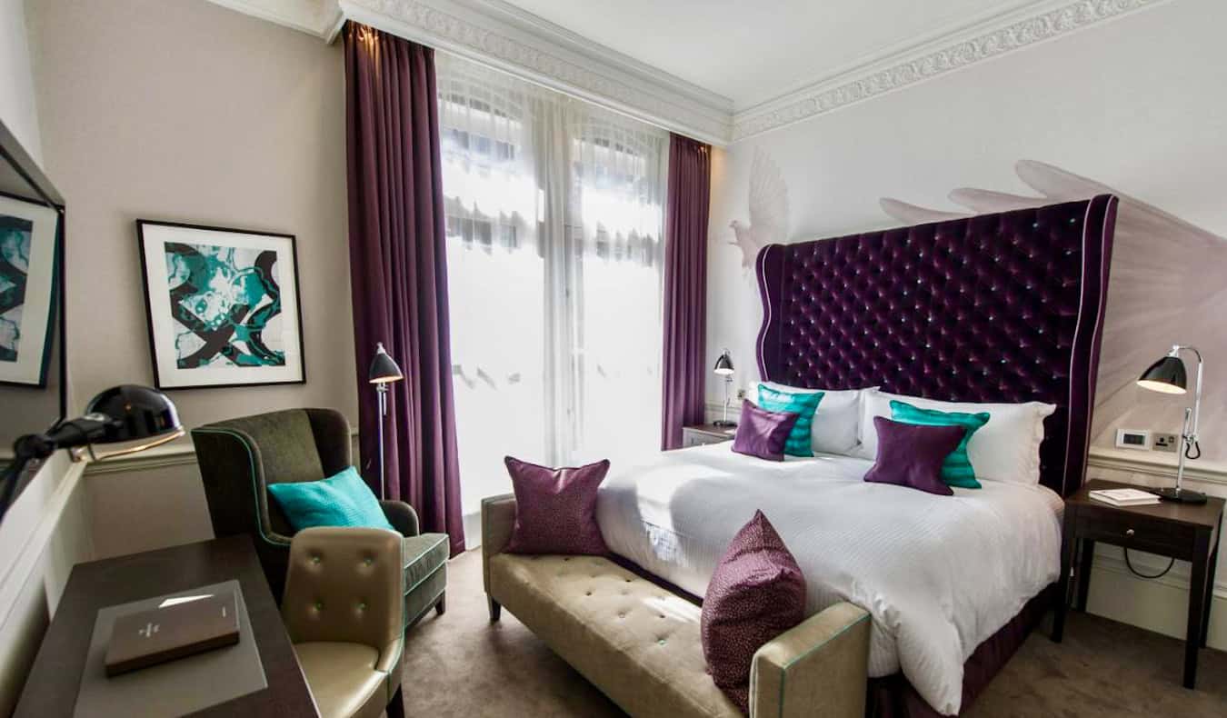 A unique and colorful boutique hotel room at the Ampersand Hotel in London, UK