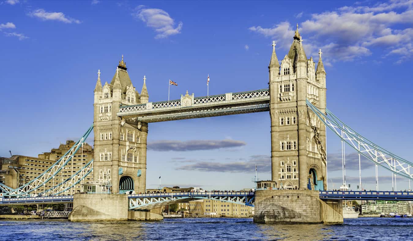 The iconic London Bridge crossing the river in beautiful London, UK on a sunny summer day