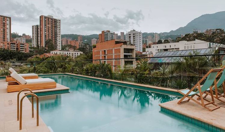 A rooftop pool overlooking the mountains at The Click Clack hotel in Medellin, Colombia