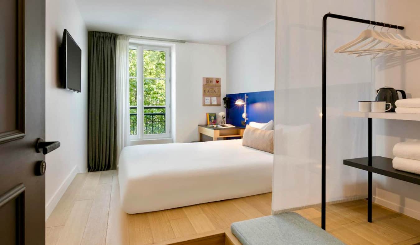 A clean, modern, and comfortable hotel room at the Oh La La hotel in Paris, France