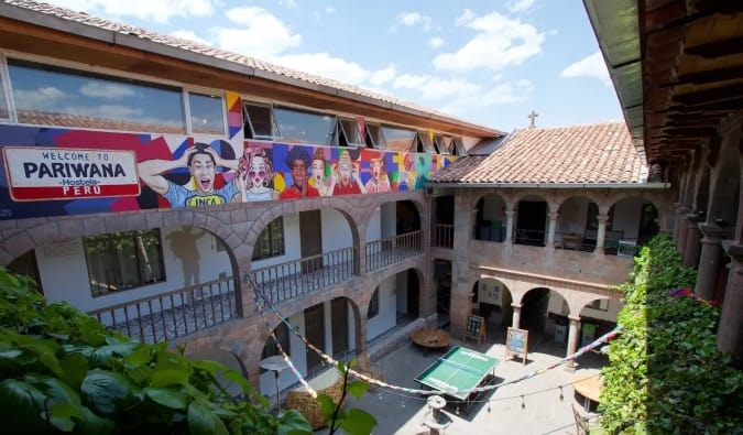 View of the colonial-style inner courtyard at Pariwana, a hostel in Cusco, Peru