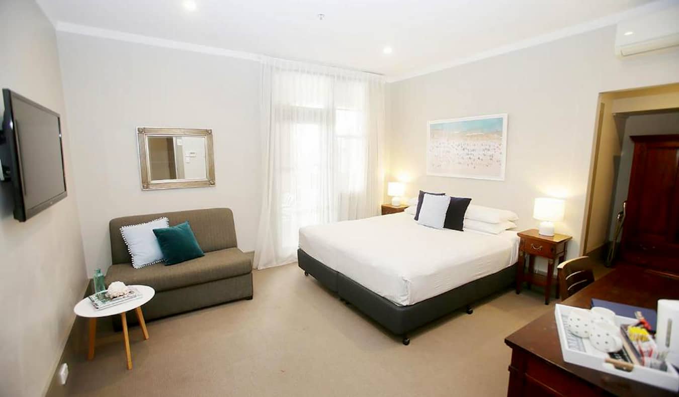 A large but simple hotel room at Hotel Bondi in Sydney, Australia