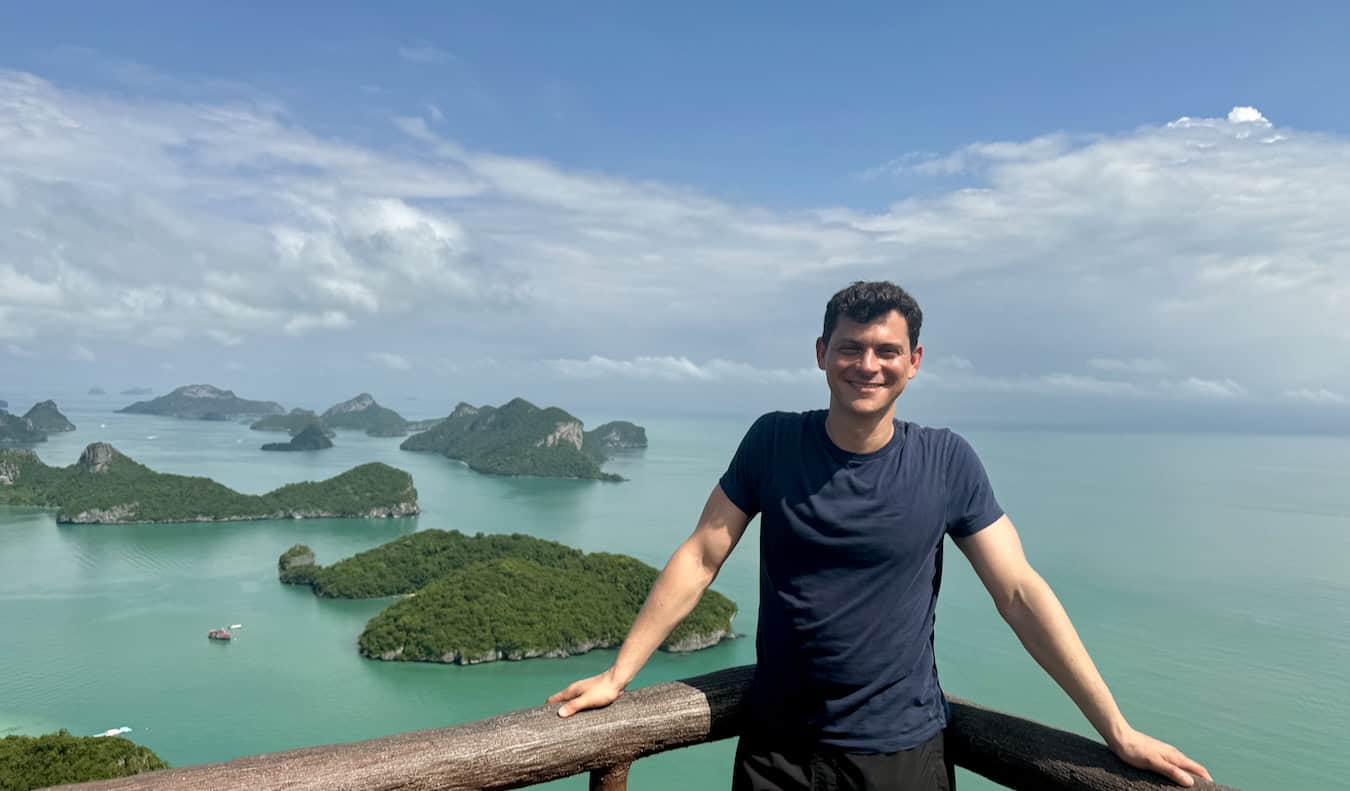 Nomadic Matt enjoying the weather at the beach on a tropical island in sunny Thailand