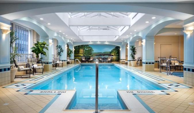 Indoor swimming pool in the glass atrium of the Fairmont Royal York Hotel in Toronto, Canada