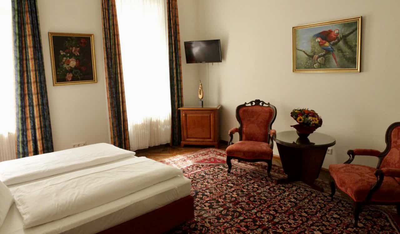 A charming hotel room with antique furniture at Hotel Domizil in Vienna, Austria