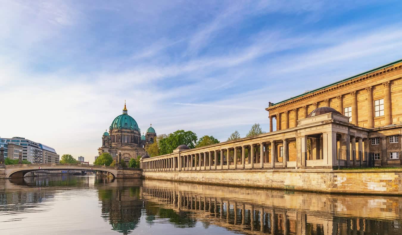 View down the Spree River at sunset with Museum Island on the right and the city on the left in Berlin, Germany