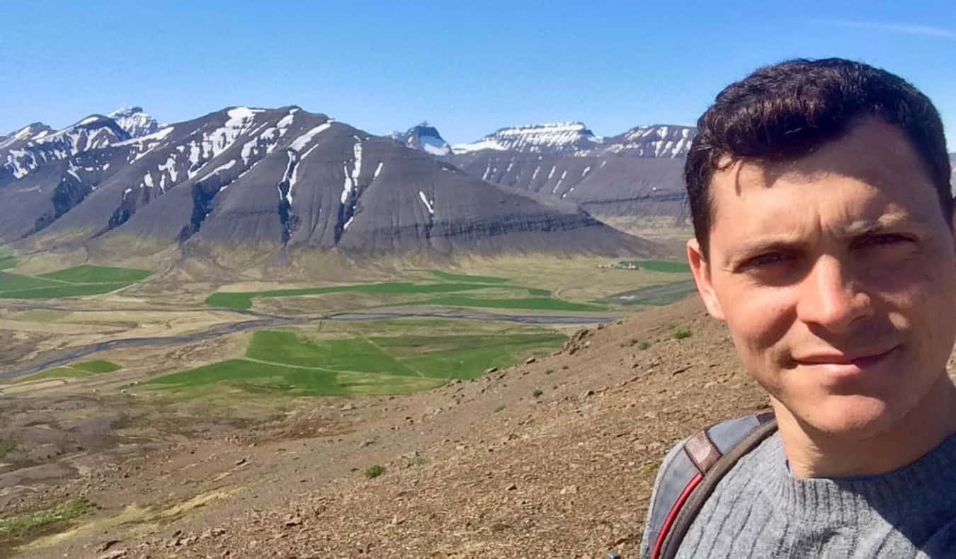 Nomadic Matt hiking in Iceland while hitchhiking around