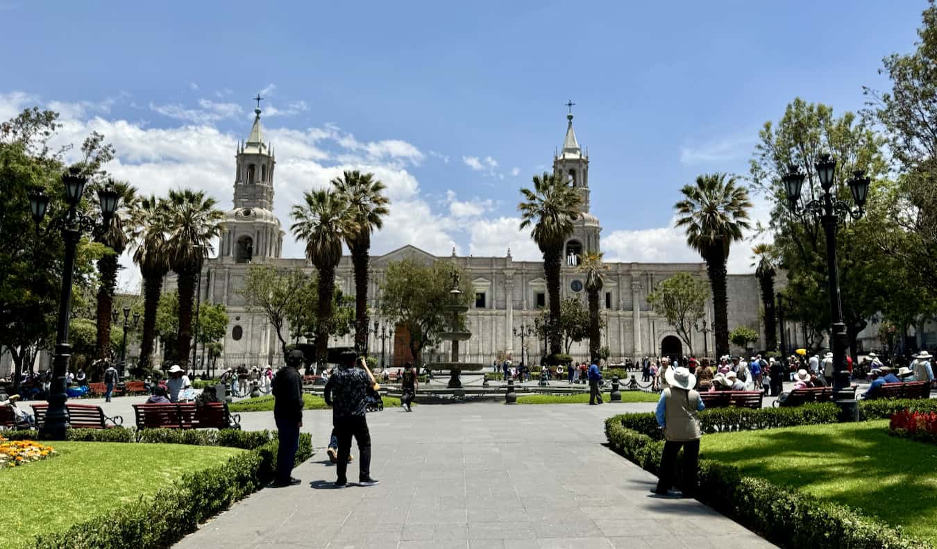 Surrounded by lots of locals and tourists, explore Peru's historic architecture