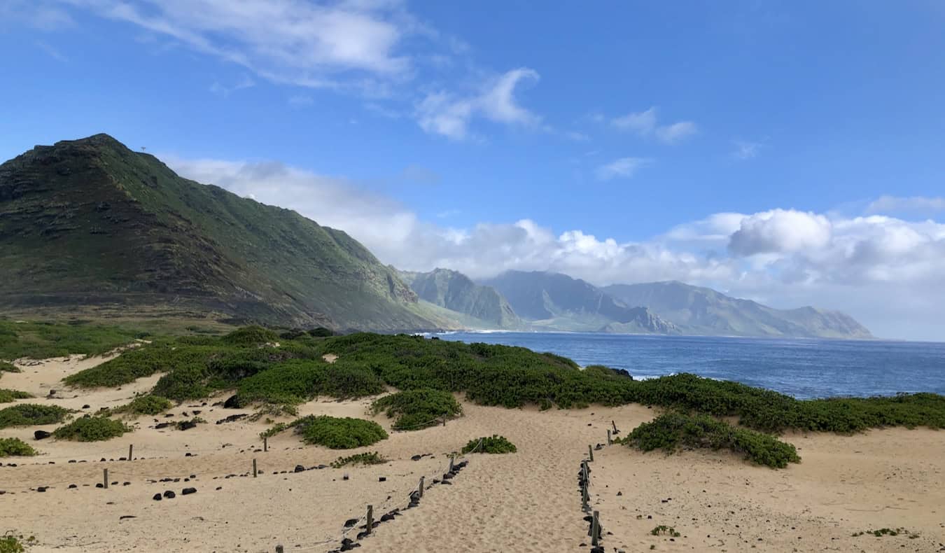 A quiet, empty beach along the rugged coast of sunny Oahu, Hawaii
