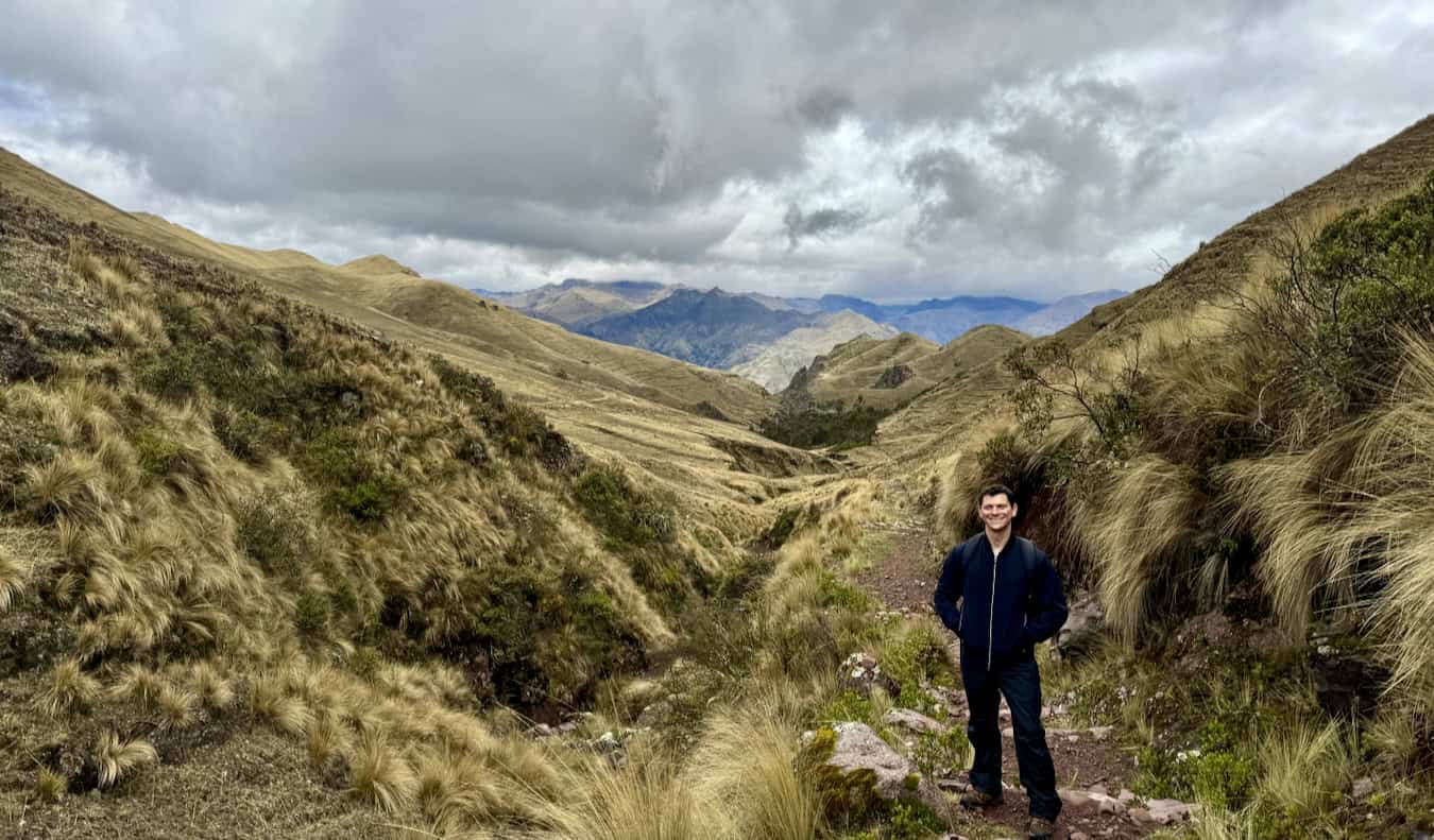 Nomadic Matt poses for photos while hiking in Peruvian mountains