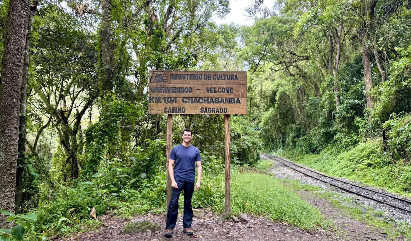 Nomad Matt poses for photos while hiking in rugged Peruvian countryside