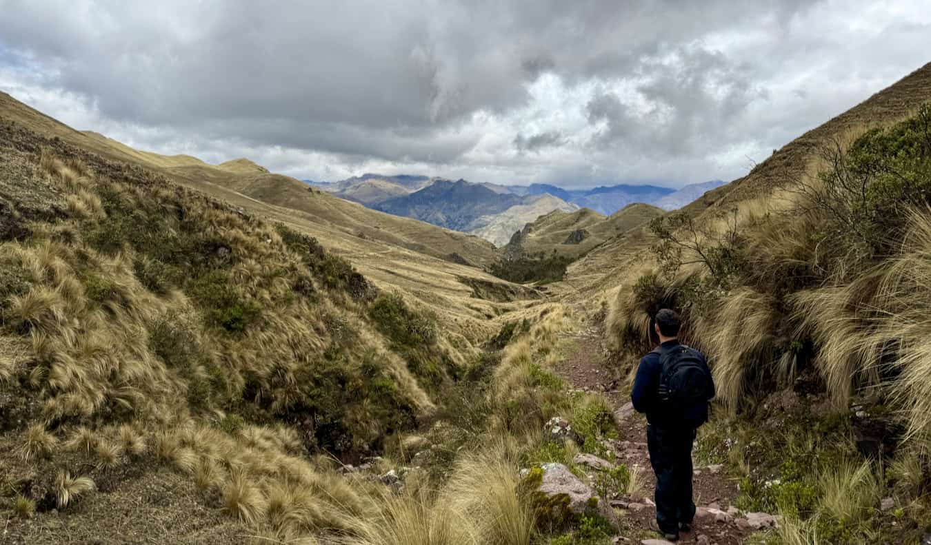 Nomadic Matt posing for a photo while hiking in Peru