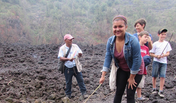 Happy female gardening overseas in the dirt