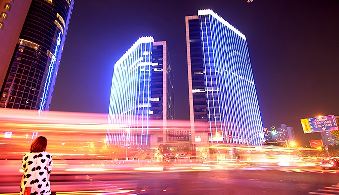 Colorful Chinese streets with buzzing traffic at night