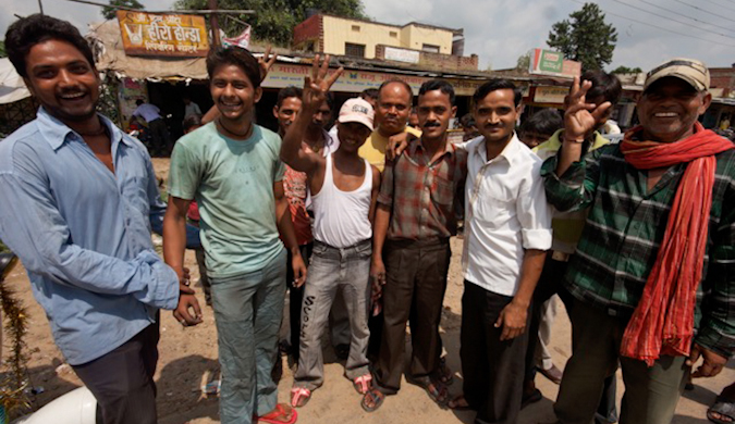 A group of friendly locals waving to the camera