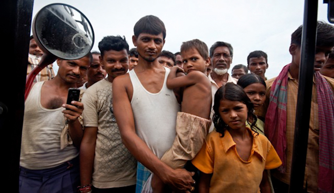 C group of curious locals in India