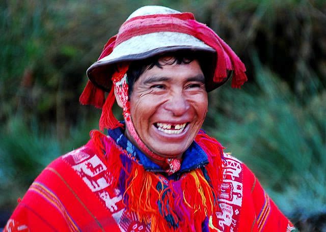 A local in South America posing with a cheesy grin for a photo