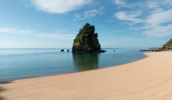 An empty beach and clear water in Abel Tasman National Park