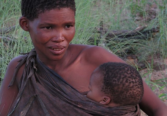 A hptoo of a bushwoman and child in Botswana, Southern Africa