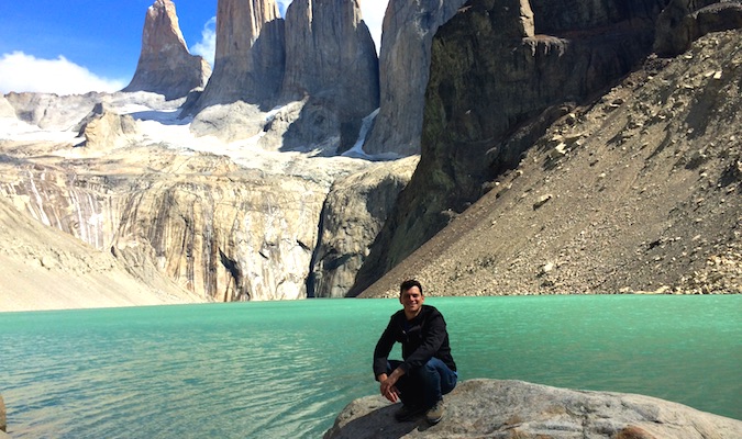 Nomadic Matt posing at Torres del Paines in South America