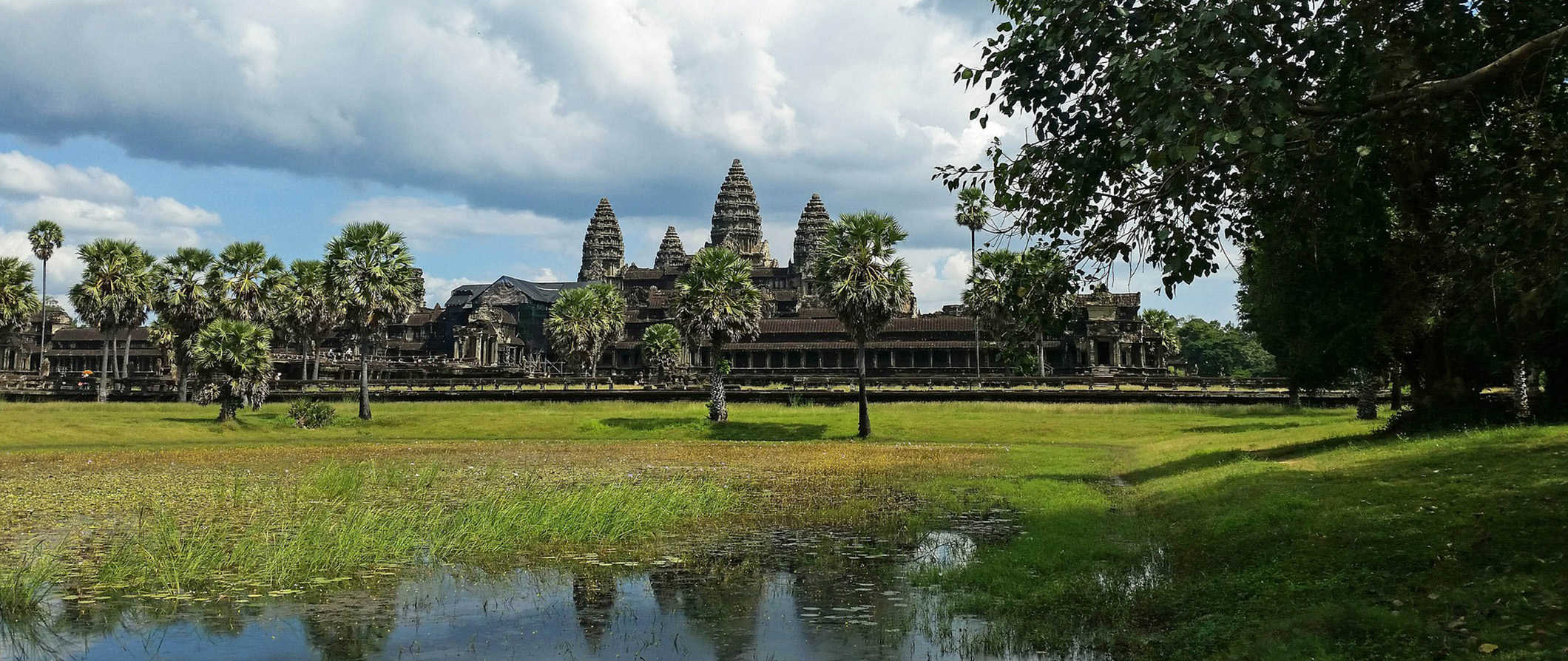 The historic Angkor Wat temple complex in Cambodia reflected in calm waters