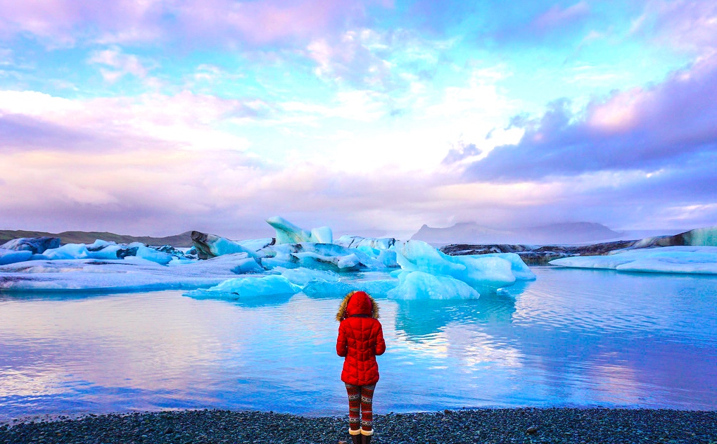 girl with amazing glaciers in iceland