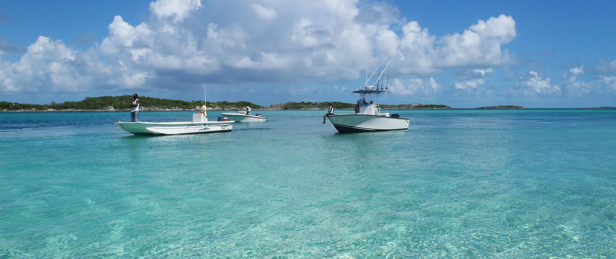 people fishing off boats in the Bahamas