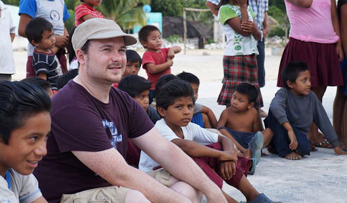 Benny speaking the local language with children