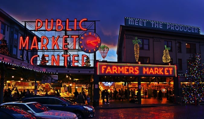 Neon Public Market sign lit up at night in Seattle, Washington