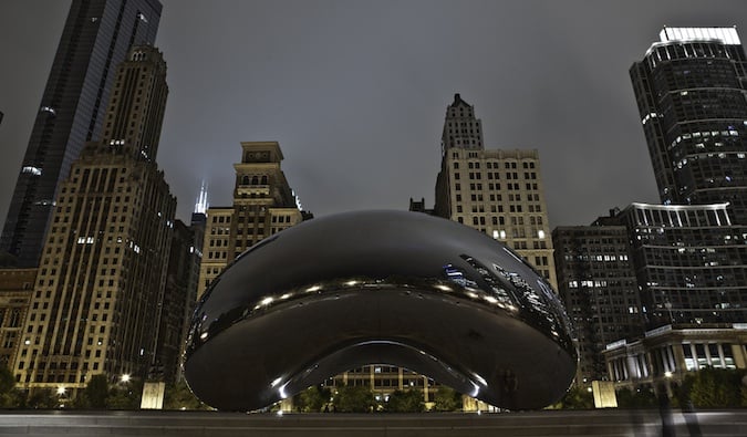 The famous bean sculpture in Chicago, Illinois shining at night