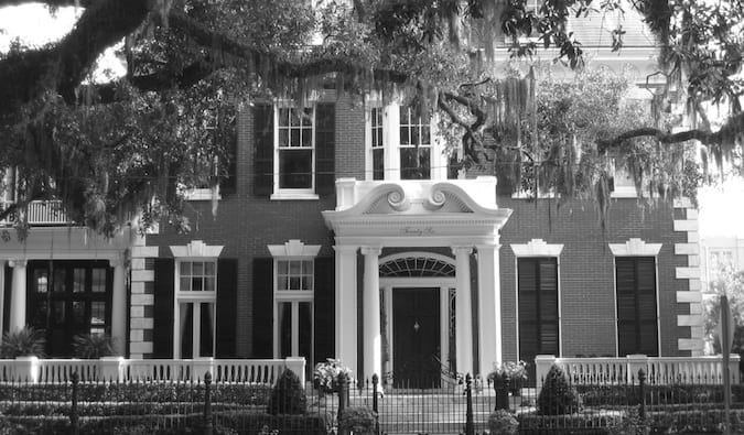 A black and white photo of an antebellum mansion in Savannah, Georgia