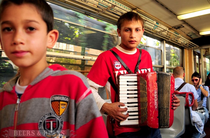 Sad Italian boys playing instruments on the bus in Sorrento