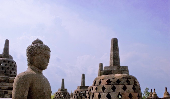 A weathered statue of Buddha at Borobudur in Indonesia