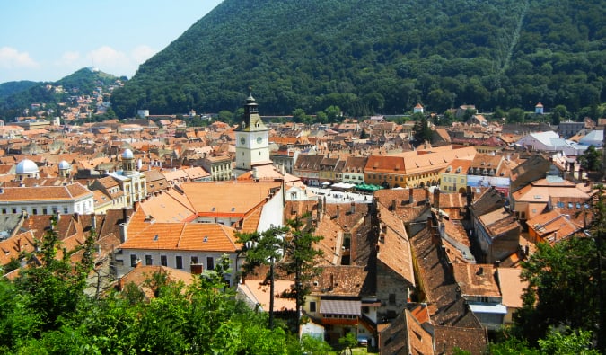 The charming city of Brasov, surrounded by green forests and mountains